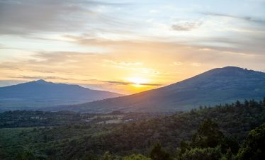 Sun set between Mount Longonot and Kijabe Hill in the Great Rift Valley.