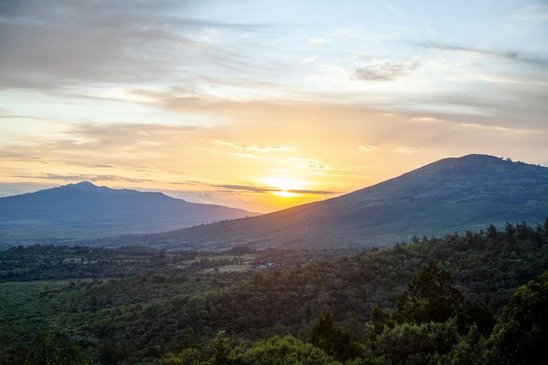 Sun set between Mount Longonot and Kijabe Hill in the Great Rift Valley.