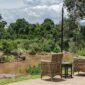 Riverside deck of a tented camp in the Masai Mara, Kenya