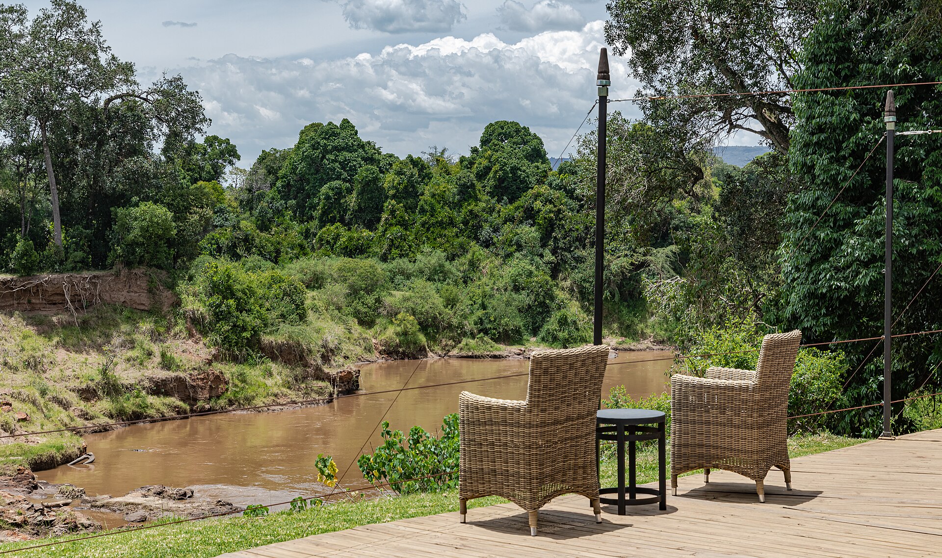 Riverside deck of a tented camp in the Masai Mara, Kenya
